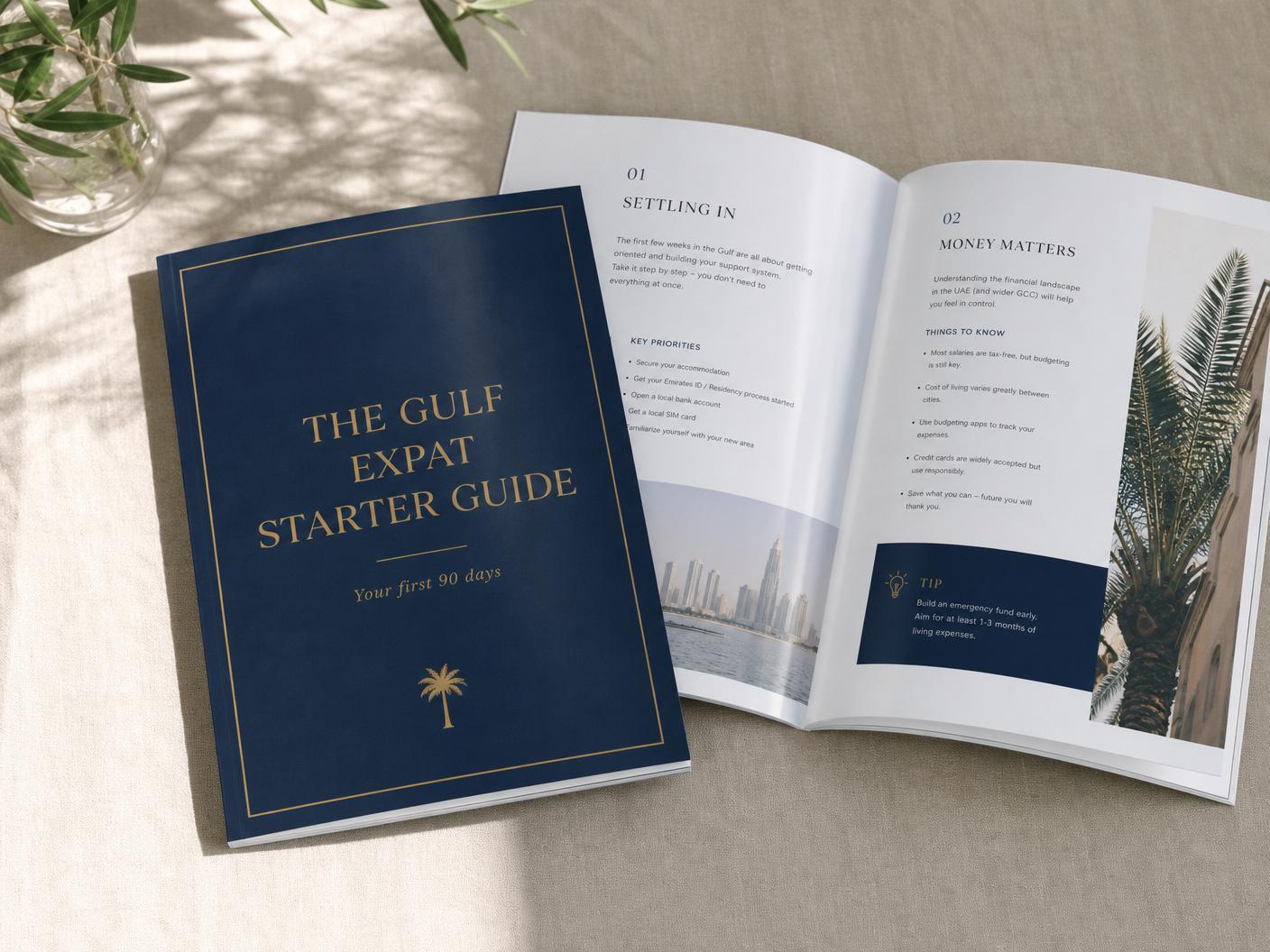 Printed Gulf Expat Starter Guide booklet shown with interior pages on a linen surface